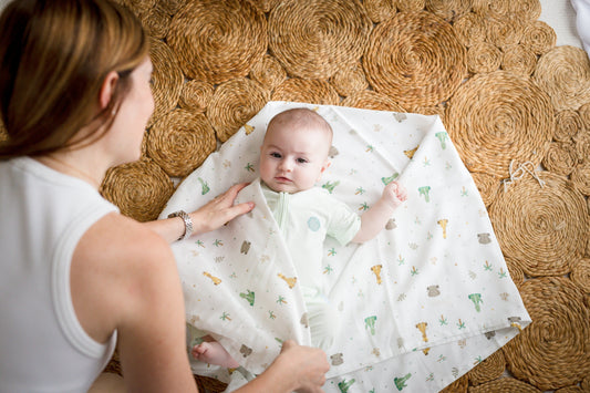 Baby wearing bamboo clothing for warm weather in Singapore.