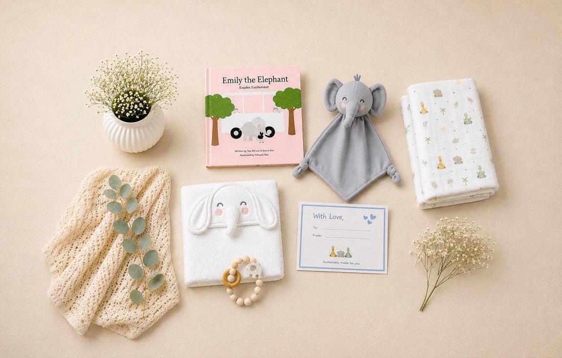 pink-koala-plush-toy-swaddle-blanket-and-gift-box-arranged-on-a-blue-surface